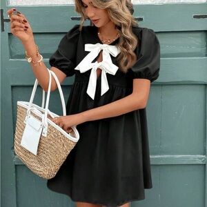 Elegant Black Dress with White Bow